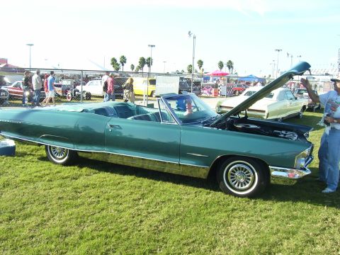 1979 Chevrolet Camaro - A 1965 Pontiac Catalina convertible is displayed with its hood open at an outdoor event.