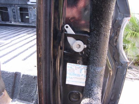 1978 Ford Bronco - Close-up of a door jamb sticker showing the VIN and manufacturing date for a 1978 Ford Bronco.