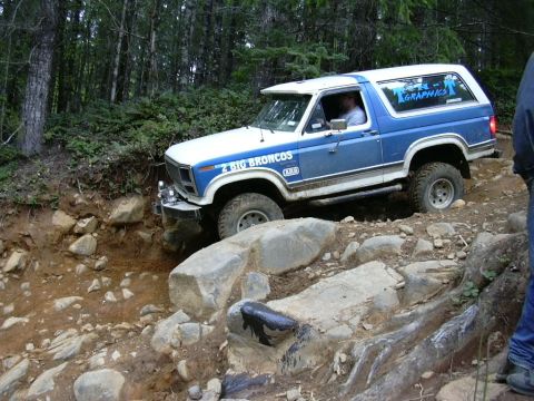 1991 Ford Bronco - This 1980 Ford Bronco is shown off-roading on a challenging rocky path.