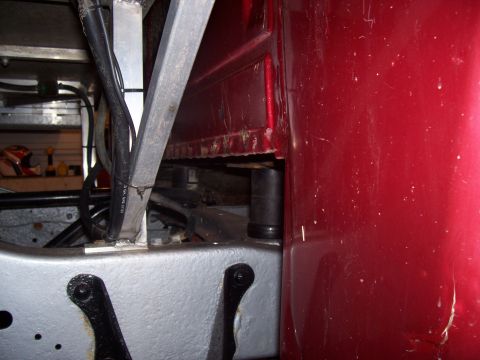 1978 Ford F-150 - Detail shot of a truck's chassis and body connection point, showing structural components and wiring.