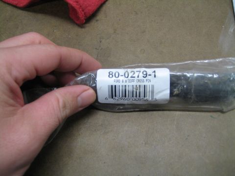 1996 Ford Bronco - A Ford 8.8 differential cross pin is shown in its packaging with a part number and barcode.