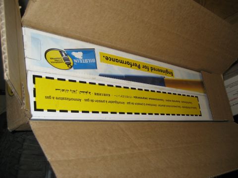 1996 Ford Bronco - A cardboard box contains packaging for Bilstein shock absorbers, with multilingual text on a yellow label.