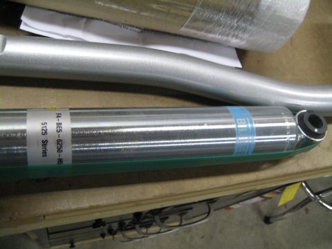 1996 Ford Bronco - A Bilstein shock absorber, identified as part number F4-BE5-6250-H5 from the 5125 Series, is shown in focus.