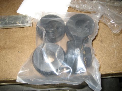 1996 Ford Bronco - Unidentified rubber bushings packaged for sale, possibly automotive parts.