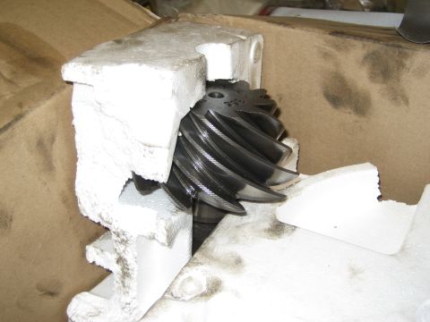 1996 Ford Bronco - A differential gear, likely a spare part, is shown secured within foam padding inside a cardboard box.