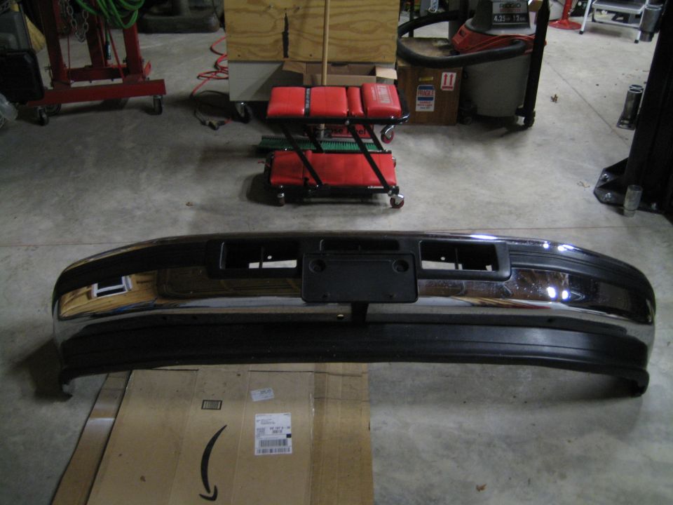 Chrome and black front bumper with license plate bracket