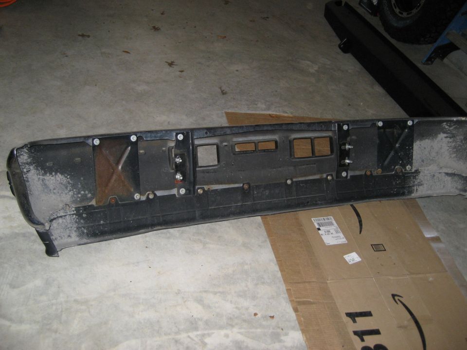 1996 Ford Bronco rear bumper assembly, black plastic with metal reinforcement