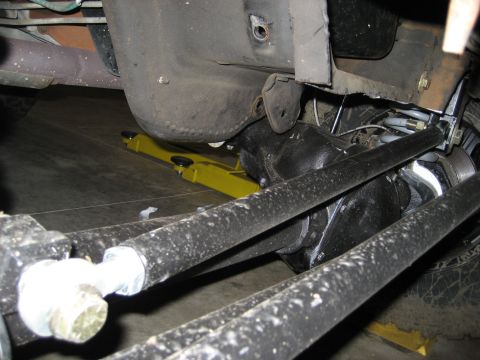 1996 Ford Bronco - Undercarriage view showing the rear axle and suspension components of a vehicle.