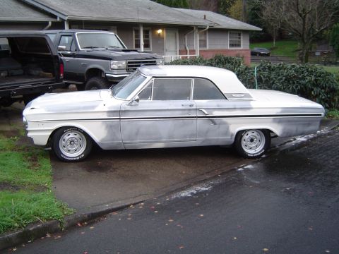 1964 Ford Fairlane - Side view of a silver 1964 Ford Fairlane convertible coupe, appearing to be in primer or unfinished paint.