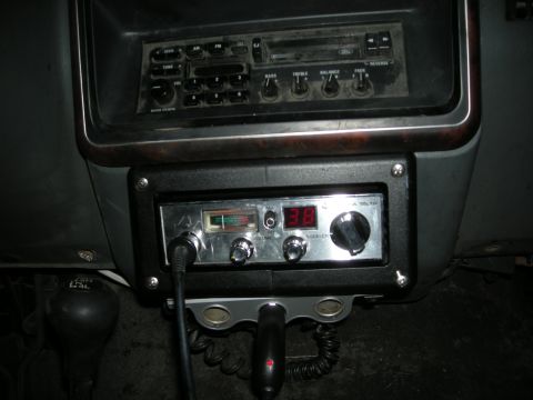 1991 Ford Bronco - The interior of the vehicle shows a CB radio mounted below the factory car stereo.