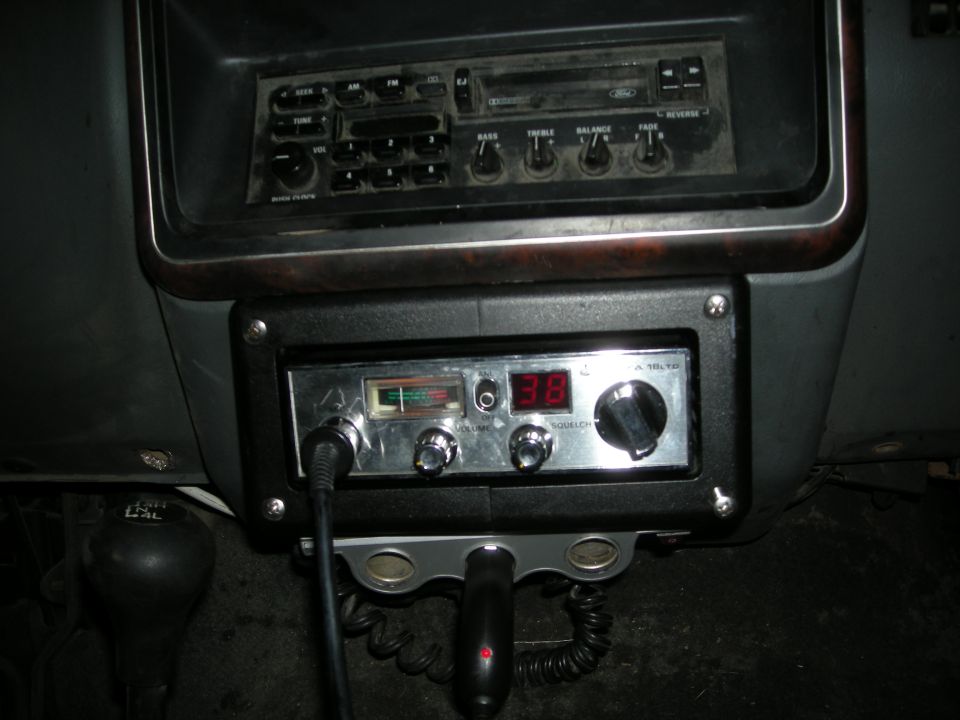 Interior view of a CB radio and car stereo with digital display