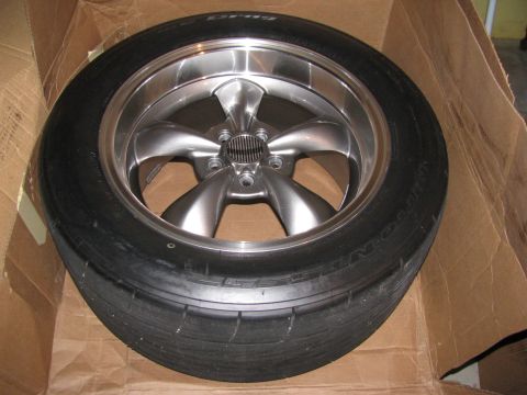 2003 Mercury Marauder - A single drag radial tire mounted on a custom alloy wheel sits in a cardboard box.