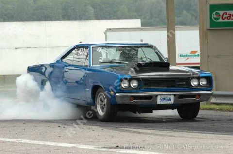 1969 Dodge Coronet - This 1969 Dodge Coronet is performing a burnout at a drag strip.