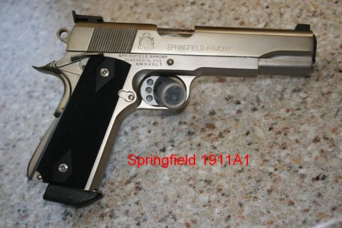 2007 Nissan Titan - A Springfield Armory 1911A1 pistol is shown in a close-up view.