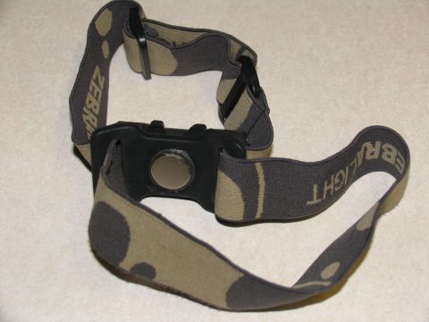 1984 Ford Bronco - A headlamp with a camouflage strap is shown against a neutral background.