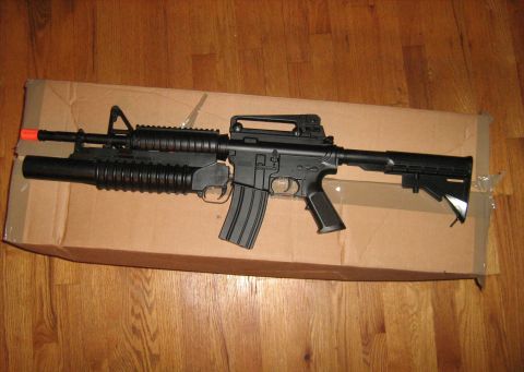 1988 Mercury Grand Marquis - Electric M4 Assault Rifle with Shotgun in place of Grenade Launcher