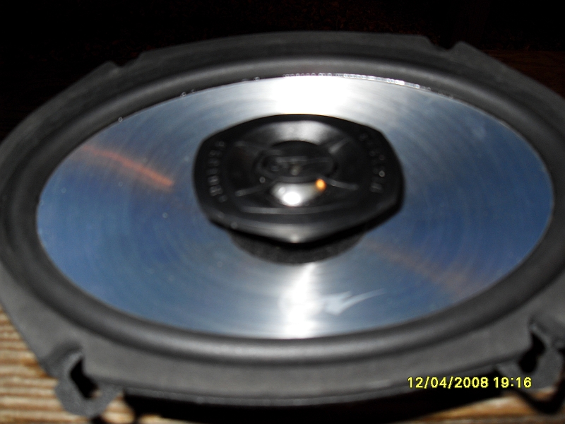 Car speaker with metallic blue cone and black center cap.