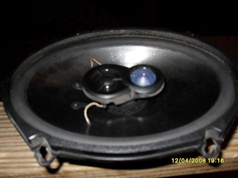 Black car speaker with silver tweeter
