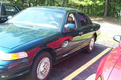 1991 Ford LTD Crown Victoria - 1991 Ford Crown Victoria LTD, seen from the front quarter angle in a parking lot.