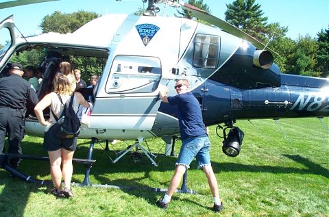 1991 Ford LTD Crown Victoria - A Massachusetts State Police helicopter is shown with its door open as people prepare to board.