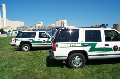 1991 Ford LTD Crown Victoria - Photograph of two U.S. Border Patrol Chevrolet/Tahoe SUVs parked on grass, not a technical document.