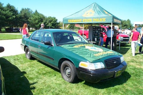 1991 Ford LTD Crown Victoria - Photograph of a Vermont State Police Ford Crown Victoria parked beside a display tent.