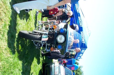 1991 Ford LTD Crown Victoria - Photograph of a police motorcycle displayed on grass at an outdoor public-safety event.