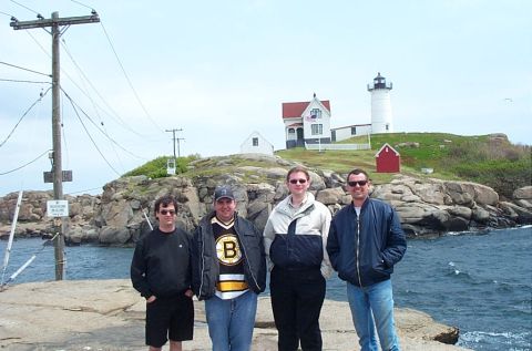 1991 Ford LTD Crown Victoria - A group of friends visited a lighthouse on a rocky coastline, enjoying the ocean view.