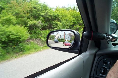 1991 Ford LTD Crown Victoria - View from inside a car, looking out the window and in the side mirror at other vehicles.