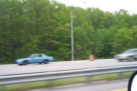 1991 Ford LTD Crown Victoria - A blue 1991 Ford Crown Victoria LTD is seen driving on a highway.