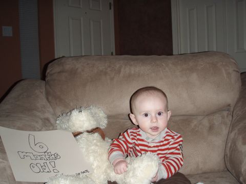1997 Ford F-250 - A baby celebrates turning six months old with a teddy bear and a handmade sign.