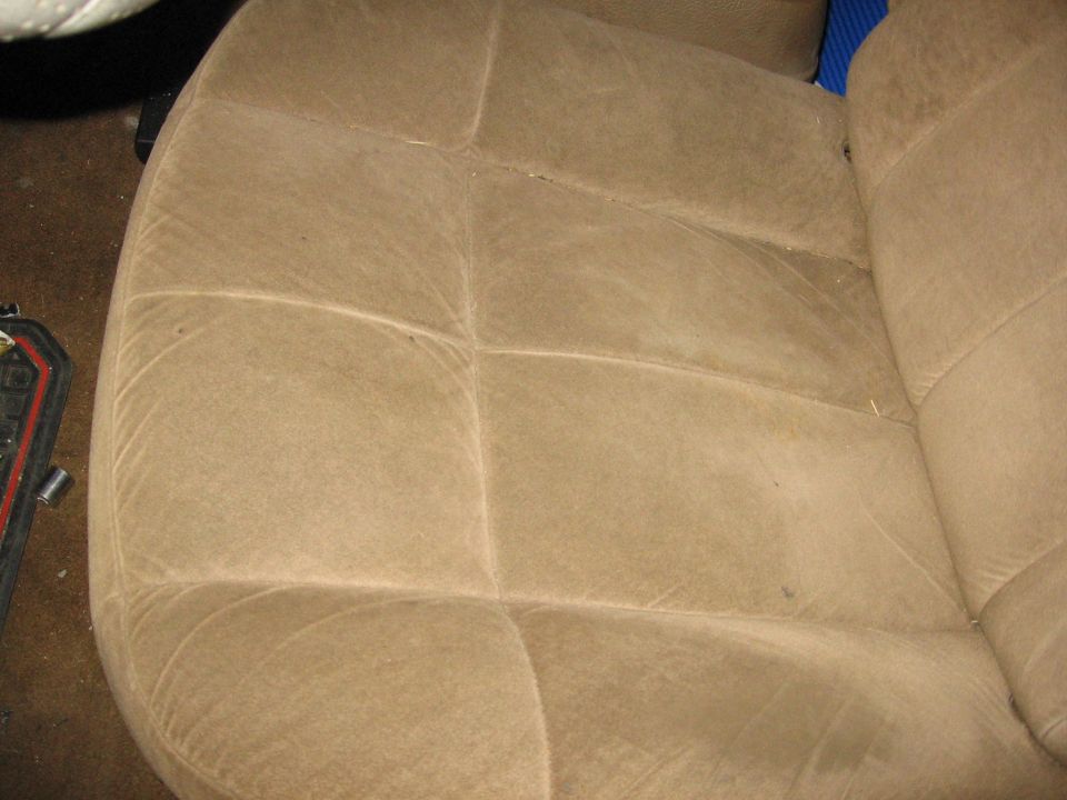 Tan fabric seat interior with visible stitching patterns