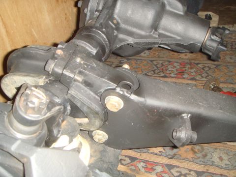 1992 Ford Bronco - Close-up of automotive differential and suspension components, with "SUPERMOTORS" visible at the bottom right.
