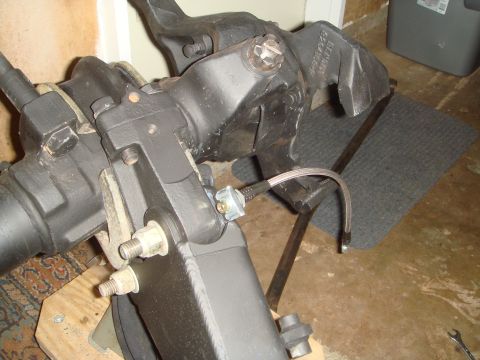 1992 Ford Bronco - Ford Bronco front axle assembly with brake lines and suspension parts visible.