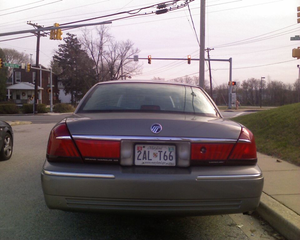 Gray 2001 Mercury Grand Marquis rear view, license plate 2AL T66, parked at an intersection