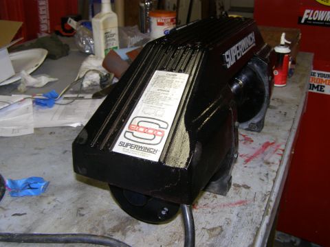 1993 Ford Bronco - A black Superwinch 8000 is on a workbench with various tools and supplies in the background.