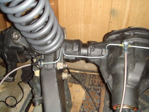 1992 Ford Bronco - Front axle and suspension components from a Ford Bronco, likely undergoing modification or repair.