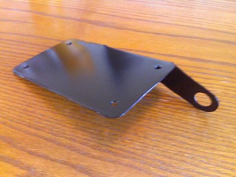 2008 Kawasaki Ninja R - A black metal license plate bracket, likely for a motorcycle, is shown on a wooden surface. The registry claims it is for a 2008 Kawasaki N…