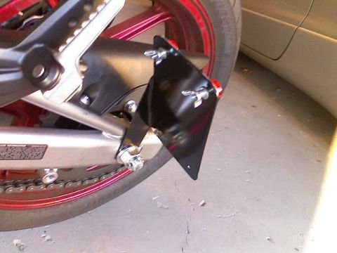 2008 Kawasaki Ninja R - Motorcycle's rear swingarm with an installed license plate bracket and part of the wheel visible.