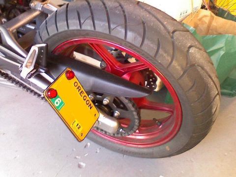 2008 Kawasaki Ninja R - The rear wheel and license plate of a motorcycle are visible.
