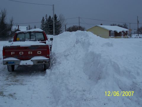 1989 Ford F-150 - Red Ford pickup truck in a snowy environment, with a date stamp of 12/06/2007 visible.