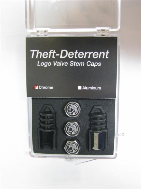 2003 Mercury Marauder - Set of theft-deterrent logo valve stem caps, the Mercury emblem.