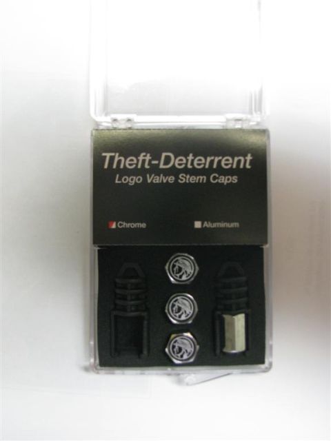 2003 Mercury Marauder - A set of "Theft-Deterrent Logo Valve Stem Caps" is displayed in its packaging.
