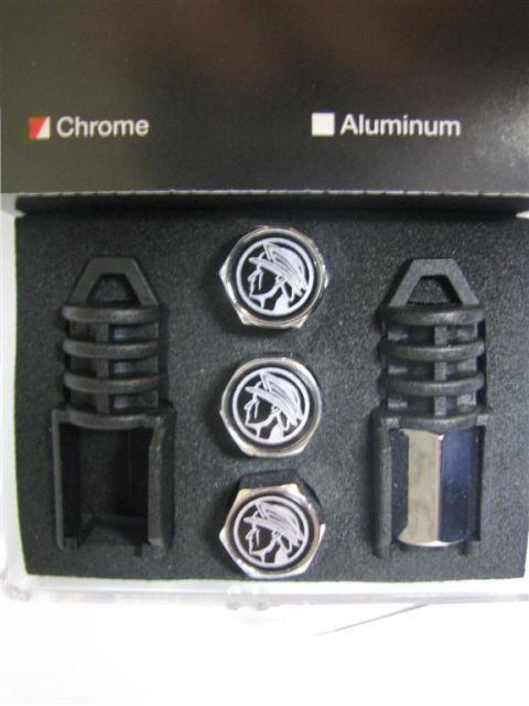 2003 Mercury Marauder - A set of valve stem caps the Mercury Marauder emblem is displayed with black plastic holders.