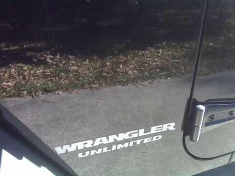2008 Jeep Wrangler - A decal reads "WRANGLER UNLIMITED" on the side of a vehicle.