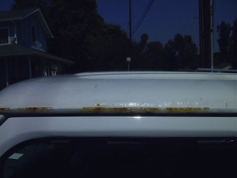 1995 Ford Bronco - More than just Rust above the drivers door. They tried to fix it at least once and the drip rail is compeltely filled in and bubbling!
