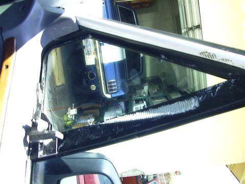 1995 Ford Bronco - Interesting gooey stuff that resembles a tape residue from either a for sale sign or covering up a busted wing window.