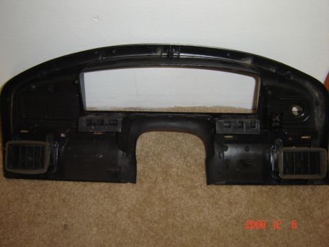 1993 Ford Bronco - Dashboard bezel with air vents and mounting points is shown.