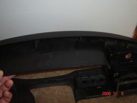 1993 Ford Bronco - Dashboard trim piece removed from a vehicle, showing internal mounting points.