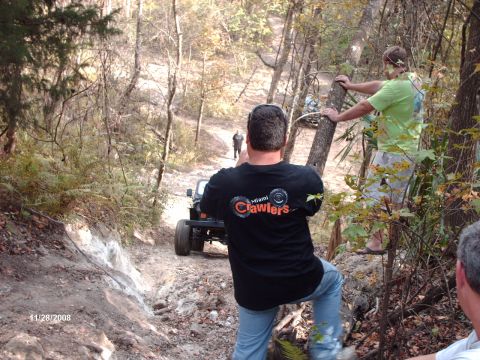 1982 Ford F-100 - Off-roading adventure with friends on a wooded trail.
